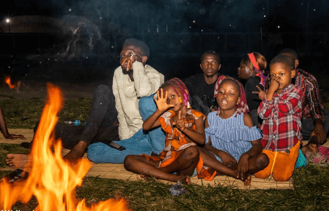 Students gathered around a bonfire